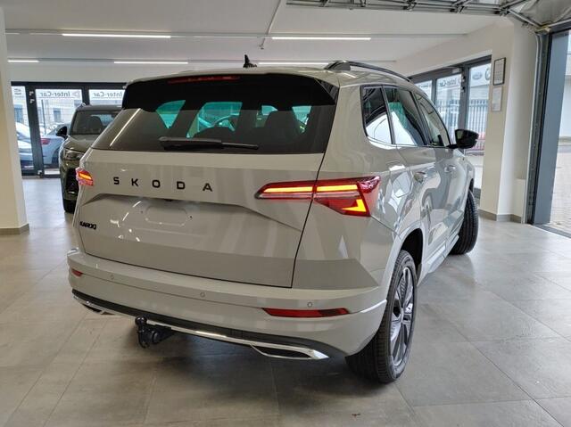 Skoda Karoq 1.5 TSI DSG SPORTLINE TREKHAAK/CAMERA/CARPLAY/ACC/STOELVERW/E-KLEP