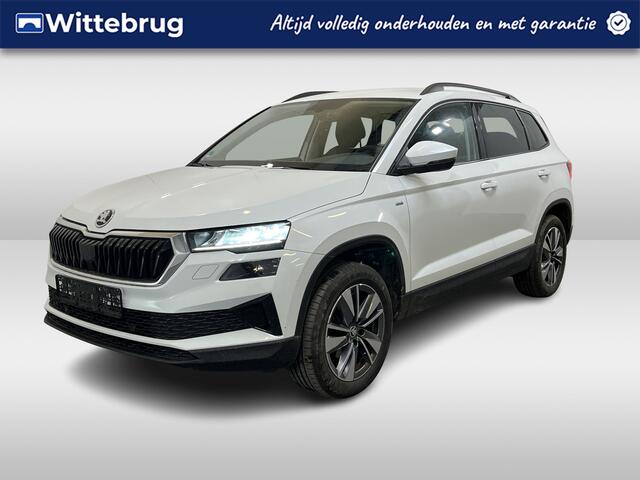 Skoda Karoq 1.0 TSI Ambition / ELEKTR. TREKHAAK/ KEYLESS/ SMARTLINK/ PARK. SENSOREN + CAMERA/ NAVI/ SPRAAKBEDIENING/ CLIMA/ STOEL-STUUR VERWARM.