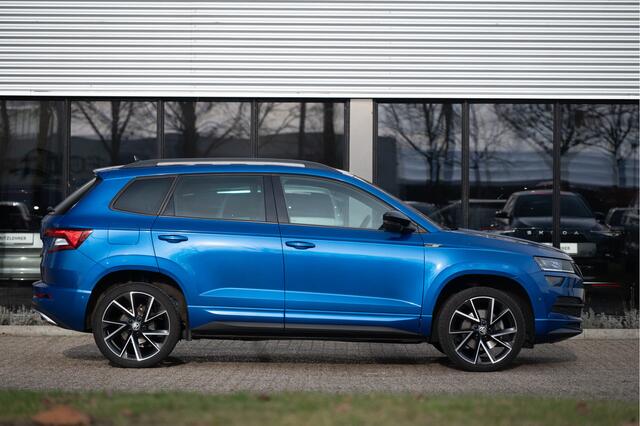 Skoda Karoq 1.5 TSI ACT Sportline Business | Trekhaak | Adapt. Cruise | CANTON | Camera | 19" | Winterpakket