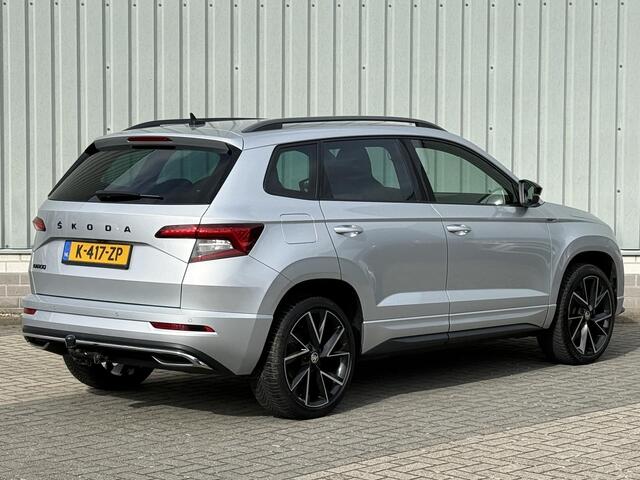 Skoda Karoq 1.5 TSI ACT Sportline Business / Nederlandse Auto / Dealer Onderhouden / All Seasonbanden / Trekhaak 1500 KG / Navigatie / Stoel- en Stuurverwarming / Adaptive Cruise Control / Voorruitverwarming / Climate Control /
