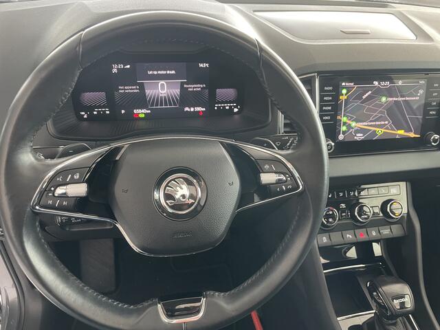 Skoda Karoq 1.5 TSI ACT Business Edition Plus Schuif/kanteldak - Achteruitrijcamera - Elektrische trekhaak - Stoelverwarming - Parkeersensoren - Airco - Apple carplay - Navigatiesysteem - Achterspoiler - Stuur multifunctioneel - Licht metalen velgen 17 inch - Bluetoo