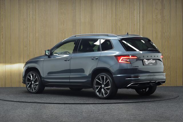 Skoda Karoq 1.5 TSI ACT Sportline Business DSG | Adaptive-cruise | Trekhaak | Camera | Clima | Stuur & Stoelverwarming | Navigatie | Virtual-Cockpit | Apple Carplay & Android Auto | Elek. Achterklep | Keyless | Dodehoekdetectie