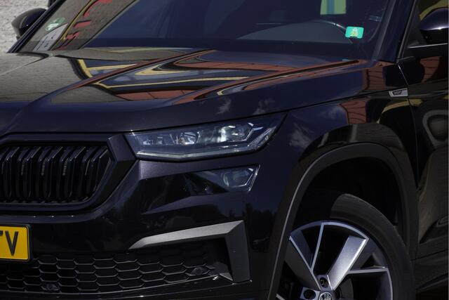 Skoda Kodiaq 1.5 TSI 150PK! Automaat Sportline Business BJ2022 Lmv | Led V+A | Pdc | Keyless | Elek. trekhaak | Elek. achterklep | Achteruitrijcamera | App-Connect | Navi | Virtual cockpit | Dashboard verlichting | Elek. Be stoel+Mem | Verwarmde voorstoelen | Nw-model