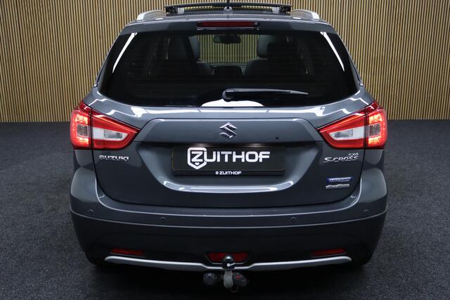 Suzuki S-Cross 1.4 Boosterjet AllGrip Style Smart Hybrid | Elek. Glazen Panoramadak | Adaptive-cruise | Afneembare Trekhaak | Leder | Camera | Clima | Parkeerhulp | Apple Carplay & Android Auto | Navigatie | Keyless | Stoelverwarming