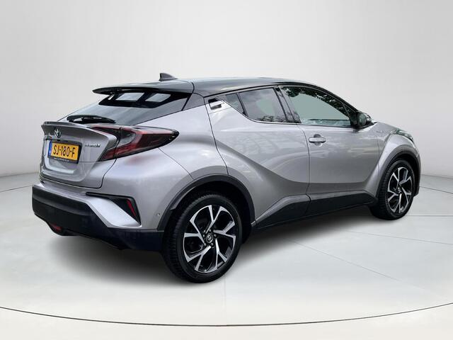 Toyota C-HR 1.8 Hybrid Bi-Tone Plus | Lederen bekleding | Stoel- + stuurverwarming | LED koplampen | Parkeersensoren |