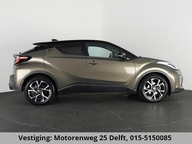 Toyota C-HR 1.8 HYBRID BI-TONE LUXERY LINE GARANTIE 5-2032 TREKHAAK. 4 SEIZOENEN BANDEN.NAVIGATIE. STUUR EN STOELVERWARMING. HALF LEDER