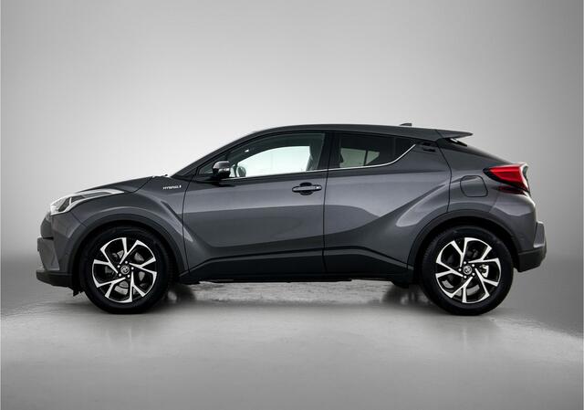 Toyota C-HR 1.8 Hybrid Style | Dodehoek detectie | Lederen bekleding | Stoel+stuurverwarming | Parkeersensoren voor+achter met assistent | Navigatie | Cruise control Adaptive |