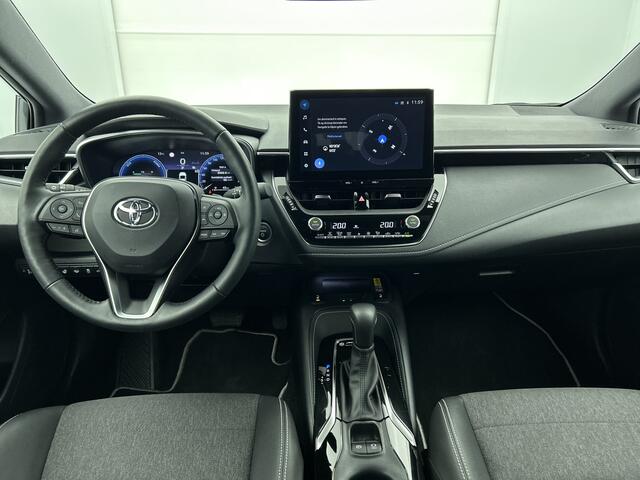 Toyota COROLLA Touring Sports Hybrid 200 First Edition | Elektrisch bedienbare achterklep | Voorruit verwarming | Stuurwiel verwarming |
