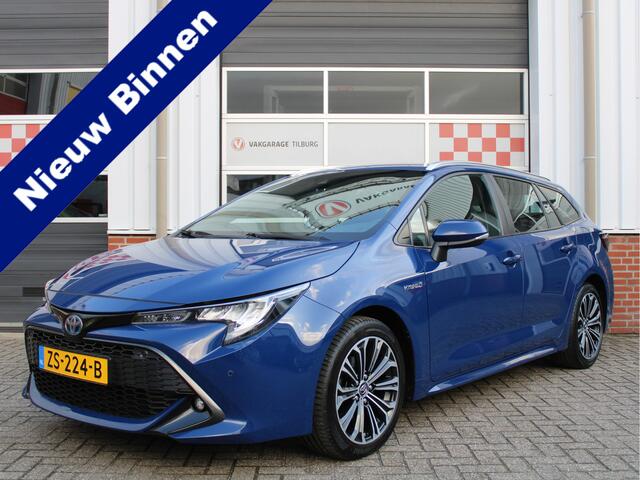 Toyota COROLLA Touring Sports 1.8 Hybrid First Edition /NAVI/PDC/Trekhaak/Regensensor/Camera/Apple carplay/DAB+/ACC/17'LM/NAP! 1e eig!