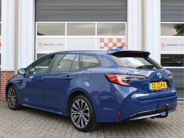 Toyota COROLLA Touring Sports 1.8 Hybrid First Edition /NAVI/PDC/Trekhaak/Regensensor/Camera/Apple carplay/DAB+/ACC/17'LM/NAP! 1e eig!