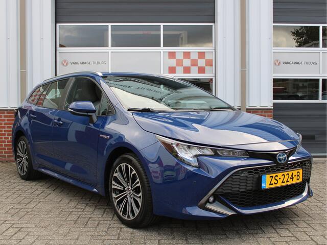 Toyota COROLLA Touring Sports 1.8 Hybrid First Edition /NAVI/PDC/Trekhaak/Regensensor/Camera/Apple carplay/DAB+/ACC/17'LM/NAP! 1e eig!