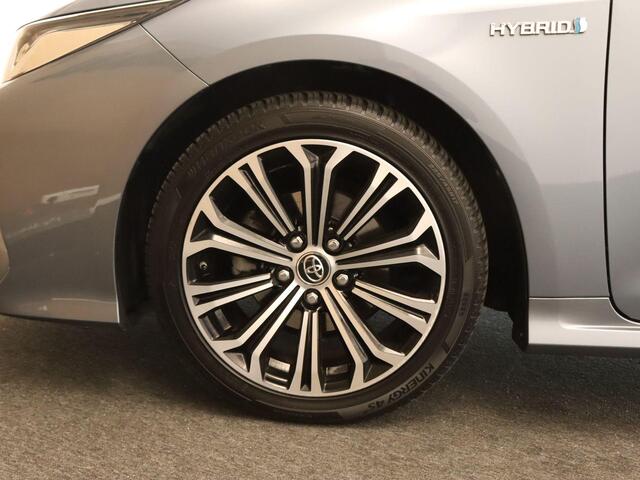 Toyota COROLLA 1.8 Hybrid Active - AFNEEMBARE TREKHAAK - TREKGEWICHT 750 KG - NAVIGATIE - CLIMATE CONTROL - 17 INCH LICHT METALEN VELGEN - KEYLESS ENTRY/ START- CAMERA - ADAPTIEVE CRUISE CONTROL - LENDESTEUN VERSTELLING BESTUURDERSSTOEL - PARKEERSENSOREN VOOR/ ACHTER - 