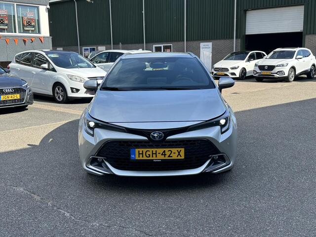 Toyota COROLLA Touring Sports Hybrid 140 Business Plus VAN ¤29.900 VOOR ¤27.877 | UW WK-VOORDEEL ¤2.023| TOYOTA GARANTIE T/M 2034| AFNEEMBARE TREKHAAK| CAMERA| STOEL + STUURVERWARMING| VOORRUITVERWARMING|
