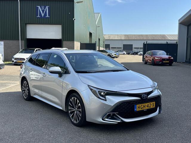 Toyota COROLLA Touring Sports Hybrid 140 Business Plus VAN ¤29.900 VOOR ¤27.877 | UW WK-VOORDEEL ¤2.023| TOYOTA GARANTIE T/M 2034| AFNEEMBARE TREKHAAK| CAMERA| STOEL + STUURVERWARMING| VOORRUITVERWARMING|