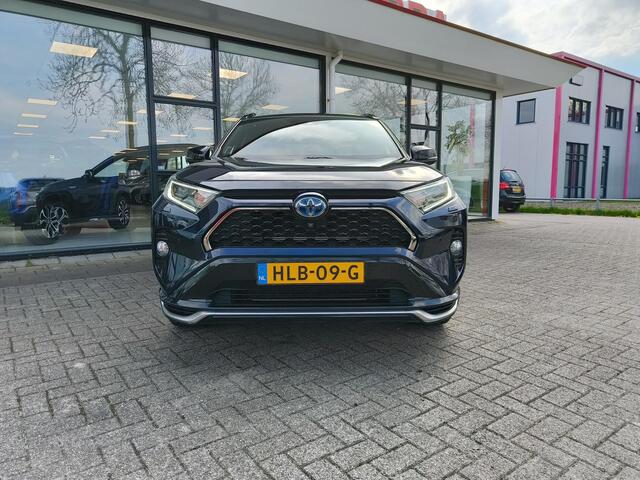 Toyota RAV4 2.5 Plug-in Hybrid AWD Bi-Tone Plus | JBL | Leer | Stoel koeling & verwarming | Trekhaak | BSM | Navi | Zeer compleet!
