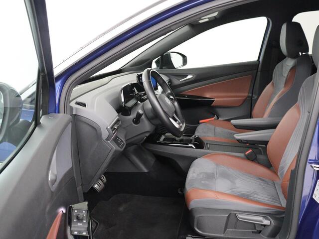 Volkswagen ID.4 First 77 kWh | SOH 90% | Stoel & stuurverwarming | Adaptive cruise | Camera | Carplay | Half leder | Navigatie | 20'' | Full LED | Keyless | Climate control | Sfeerverlichting