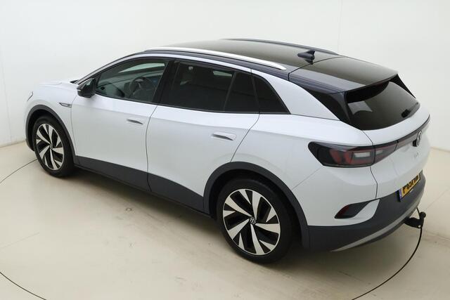 Volkswagen ID.4 First 77 kWh | Apple carplay/Android auto | Automatische airco | Navigatie | Cruise control adaptief | Trekhaak | Licht metalen velgen 20''|