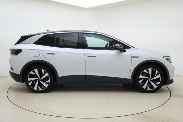 Volkswagen ID.4 First 77 kWh | Apple carplay/Android auto | Automatische airco | Navigatie | Cruise control adaptief | Trekhaak | Licht metalen velgen 20''|