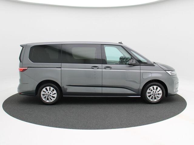 Volkswagen MULTIVAN 1.4 218 Pk Automaat eHybrid L2H1 Style | 7 Persoons | Adaptive Cruise | CarPlay | Camera | Panoramadak | Stoelverwarming | Trekhaak | 23.392 Km!!