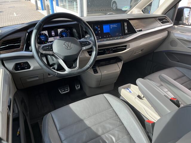 Volkswagen MULTIVAN 1.4 eHybrid L2H1 Style / 7 PERS./ AUTOMAAT/ TREKHAAK/ LEER/ HARMAN&KARDON/ CLIMA/ APP-CONNECT/ NAVI/ CRUISE/ STOELVERWARM./ DIGITAL DASH/ PARK. SENSOREN + CAMERA