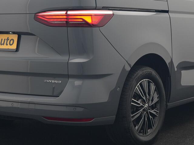 Volkswagen MULTIVAN 1.4 eHybrid Bulli 7 Zits PHEV 218pk Dealer O.H | Trekhaak Af Fabriek | Adaptive Cruise | Camera | Sportstoelen & Stuur Verwarmd | Apple Carplay | BLIS | Navigatie | Virtual | DAB | 17"L.M | Plug In Hybrid |