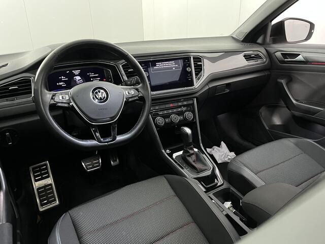 Volkswagen T-Roc 1.5 TSI R-Line / AUTOMAAT/ PANO/ STUUR+STOELVERWARM./ PARK.SENSOR.V+A/ CAMERA/ DODE HOEK/ APP-CONNECT/ ELEK.KLEP/ KEYLESS/ ACC/ RIJ-MODI/ DIGITAL DASH/ NAVI/ DAB/ CLIMA/ LED/ ISOFIX