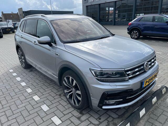 Volkswagen TIGUAN 2.0 TSI 4Motion R-Line 7p 7 zits r-line in en exterieur panoramadak 20" LMV Suzuka head up display discover pro navi digital cockpit pro area view rondom zicht camera verwarmbare voorruit stoelverwarming elektrische achterklep keyless entry wegklapbare tr