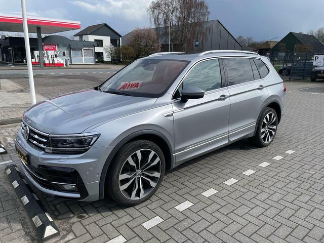 Volkswagen TIGUAN 2.0 TSI 4Motion R-Line 7p 7 zits r-line in en exterieur panoramadak 20" LMV Suzuka head up display discover pro navi digital cockpit pro area view rondom zicht camera verwarmbare voorruit stoelverwarming elektrische achterklep keyless entry wegklapbare tr