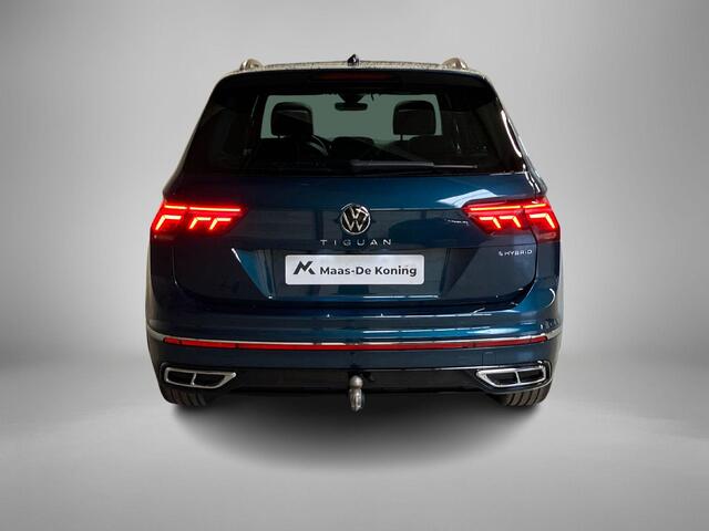 Volkswagen TIGUAN 1.4TSIeHybrid 180kW/245PK R-Line DSG · Panoramadak · Trekhaak · 360°Camera + Parkeersensoren · Garantie t/m 19-06-2026 of 60000km.