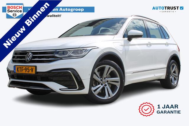 Volkswagen TIGUAN 1.4 TSI eHybrid R-Line Business+ | Incl. 12 maanden garantie | SOH 92% | Stoel/stuurverwarming | Parkeercamera | Wegklapbare trekhaak | DAB radio | Apple carplay/Android auto | 100% dealer onderhouden |