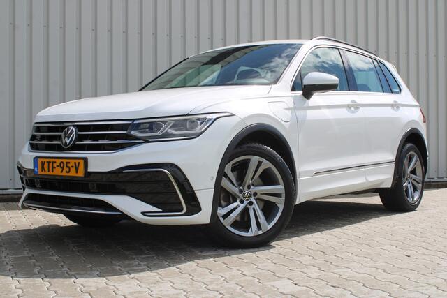 Volkswagen TIGUAN 1.4 TSI eHybrid R-Line Business+ | Incl. 12 maanden garantie | SOH 92% | Stoel/stuurverwarming | Parkeercamera | Wegklapbare trekhaak | DAB radio | Apple carplay/Android auto | 100% dealer onderhouden |