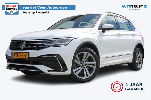 Volkswagen TIGUAN 1.4 TSI eHybrid R-Line Business+ | Incl. 12 maanden garantie | SOH 92% | Stoel/stuurverwarming | Parkeercamera | Wegklapbare trekhaak | DAB radio | Apple carplay/Android auto | 100% dealer onderhouden |