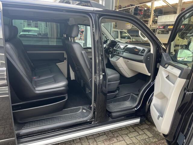Volkswagen TRANSPORTER 2.0 TDI L2H1 DC 2x elektrische schuifdeur Leder Apple carplay Schuifdak Stoelverwarming Trekhaak Navigatiesysteem Sitebars Stuurwielbediening Parkeersensoren voor en achter Euro 6