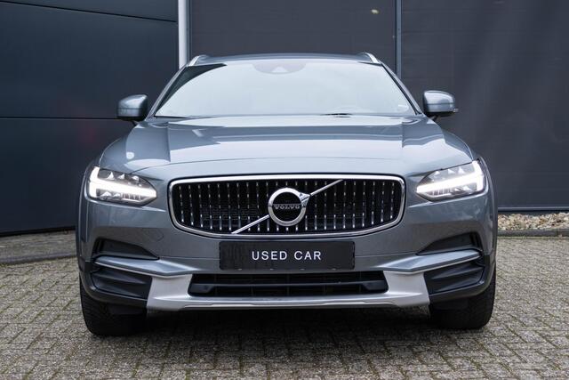 Volvo V90 Cross Country 2.0 T5 AWD Panoramisch schuif-kantel dak | Polestar Engineered Optimalisatie | Klasse III Alarm | Verwarmbare voorstoelen | Parkeerverwarming | Achterbank en Stuurwiel verwarming | Grafisch Head-Up-Display | Parkeer Camera |