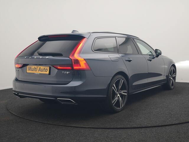 Volvo V90 T8 AWD R-Design PHEV 394pk Dealer O.H. | Trekhaak Af Fabriek | Four C Luchtvering | Panodak | Adaptive Cruise | Head Up | 360 Camera | Bowers & Wilkins | Lederen Sportstoelen Massage & Ventilatie & Memory | Stoelen & Stuur Verwarm Apple Carplay | Navigatie | DAB | 20"L.M | Plug In Hybrid |