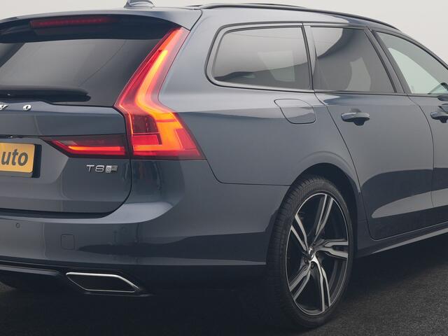 Volvo V90 T8 AWD R-Design PHEV 394pk Dealer O.H. | Trekhaak Af Fabriek | Four C Luchtvering | Panodak | Adaptive Cruise | Head Up | 360 Camera | Bowers & Wilkins | Lederen Sportstoelen Massage & Ventilatie & Memory | Stoelen & Stuur Verwarm Apple Carplay | Navigatie | DAB | 20"L.M | Plug In Hybrid |