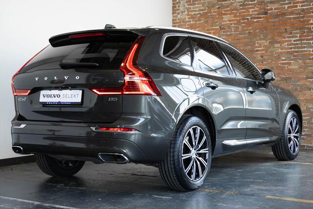 Volvo XC60 B5 Automaat Business Pro | Trekhaak | 360° parkeercamera | Adaptive cruise control | BLIS | Stoelverwarming | Stuurwielverwarming | Navigatie | Maroon lederen bekleding | Comfortstoelen |