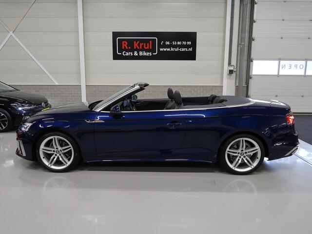 Audi A5 Cabriolet 40 TFSI Launch edition Sport S-Line Matrix Nekverwarming Trekhaak 3-Zone airco Digitaal dashboard Camera ACC Navigatie Automaat Alcantara Massagestoelen App connect 19 inch Sportvelgen Navarrablauw metallic Nieuwstaat