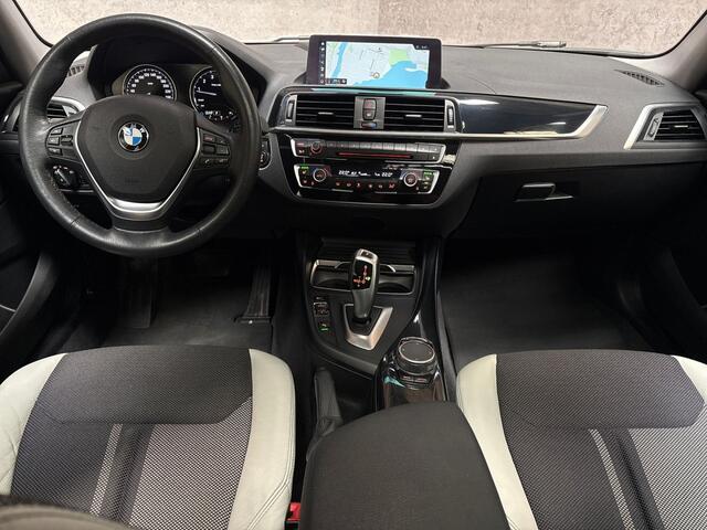 BMW 1-SERIE 120i Sport Line Shadow High Executive 184Pk Automaat (SCHUIFDAK, GROOT NAVI, DEALER ONDERHOUDEN, MEMORY SEATS, LEDER, STUUR/STOELVERWARMING, PARKEERSENSOREN, TREKHAAK, NIEUWSTAAT)