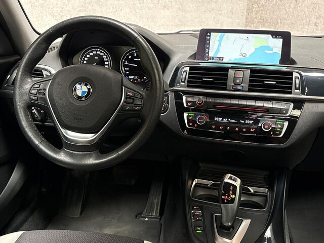 BMW 1-SERIE 120i Sport Line Shadow High Executive 184Pk Automaat (SCHUIFDAK, GROOT NAVI, DEALER ONDERHOUDEN, MEMORY SEATS, LEDER, STUUR/STOELVERWARMING, PARKEERSENSOREN, TREKHAAK, NIEUWSTAAT)