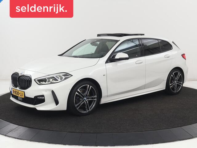 BMW 1-SERIE 118i High Executive Edition | M Sport | Panoramadak | Leder | Stoelverwarming | Camera | Carplay | Live Cockpit | Sfeerverlichting | Trekhaak | Navigatie | Sportstoelen | Park Assist | DAB | Climate control