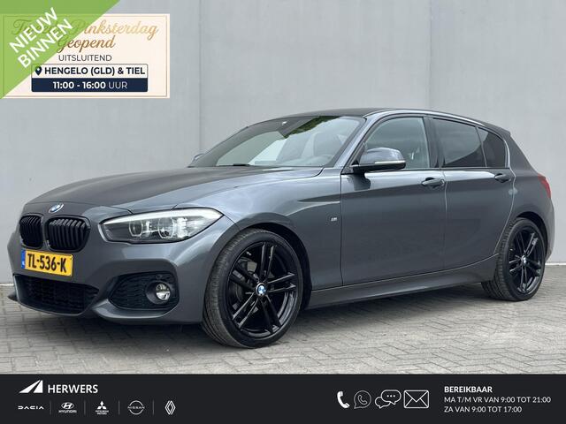 BMW 1-SERIE 118i High Executive M Sport Shadow / Cruise Control / M-stuur / Apple Carplay&Android Auto / Led Koplampen / Electronic Climate Control / Voorstoelen Verwarmd / Navigatie / Parkeersensoren Voor&Achter / Hifi Speakers