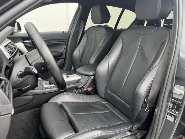 BMW 1-SERIE 118i High Executive M Sport Shadow / Cruise Control / M-stuur / Apple Carplay&Android Auto / Led Koplampen / Electronic Climate Control / Voorstoelen Verwarmd / Navigatie / Parkeersensoren Voor&Achter / Hifi Speakers
