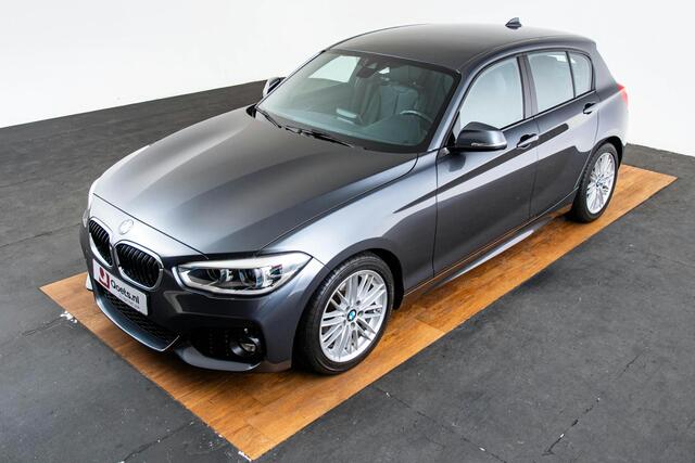 BMW 1-SERIE 118i Edition M Sport Shadow High Executive Middenarmsteun - PDC Voor/achter - Cruise Control - Sportstoelen - Elektrisch verstelbare lendensteunen - Elektrisch verwarmde voorstoelen - Navigatiesysteem Business -