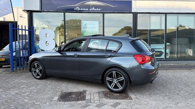 BMW 1-SERIE 118i Centennial High Executive | AUTOMAAT | PANODAK | LEER