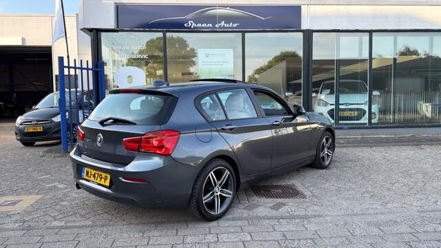 BMW 1-SERIE 118i Centennial High Executive | AUTOMAAT | PANODAK | LEER