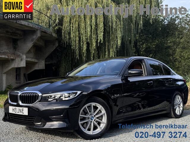 BMW 3-SERIE 320e BUSINESS+ EDITION LEDER/CAMERA/TREKHAAK