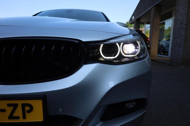 BMW 3-SERIE GT Gran Turismo 320i High Executive Edition M-Sport PANO STOELVERW. CAMERA LEER ELEC-KLEP DAB NAVI CRUISE CLIMA 2XPDC 19''LMV NAP