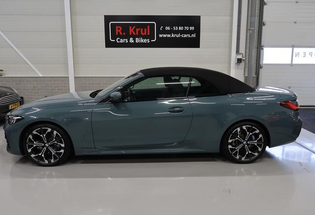 BMW 4-SERIE Cabrio 420i High Executive M-Sport Sportstoelen Camera Stoelverwarming Curved dashboard Navigatie Airco-ecc 19 inch Sportvelgen App connect Cape York Green metallic Zwart sportleer
