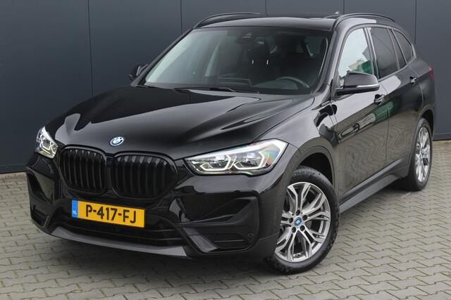 BMW X1 xDrive25e Business Edition Plus | Incl. 12 maanden garantie | Head-up display | Parkeersensoren | Verwarmde voorstoelen | Schuif/kantel dak | Climate control | Lichtmetalen velgen | Elektrische kofferklep | Cruise control | Bluetooth